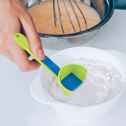 Measuring spoon with movable scoop